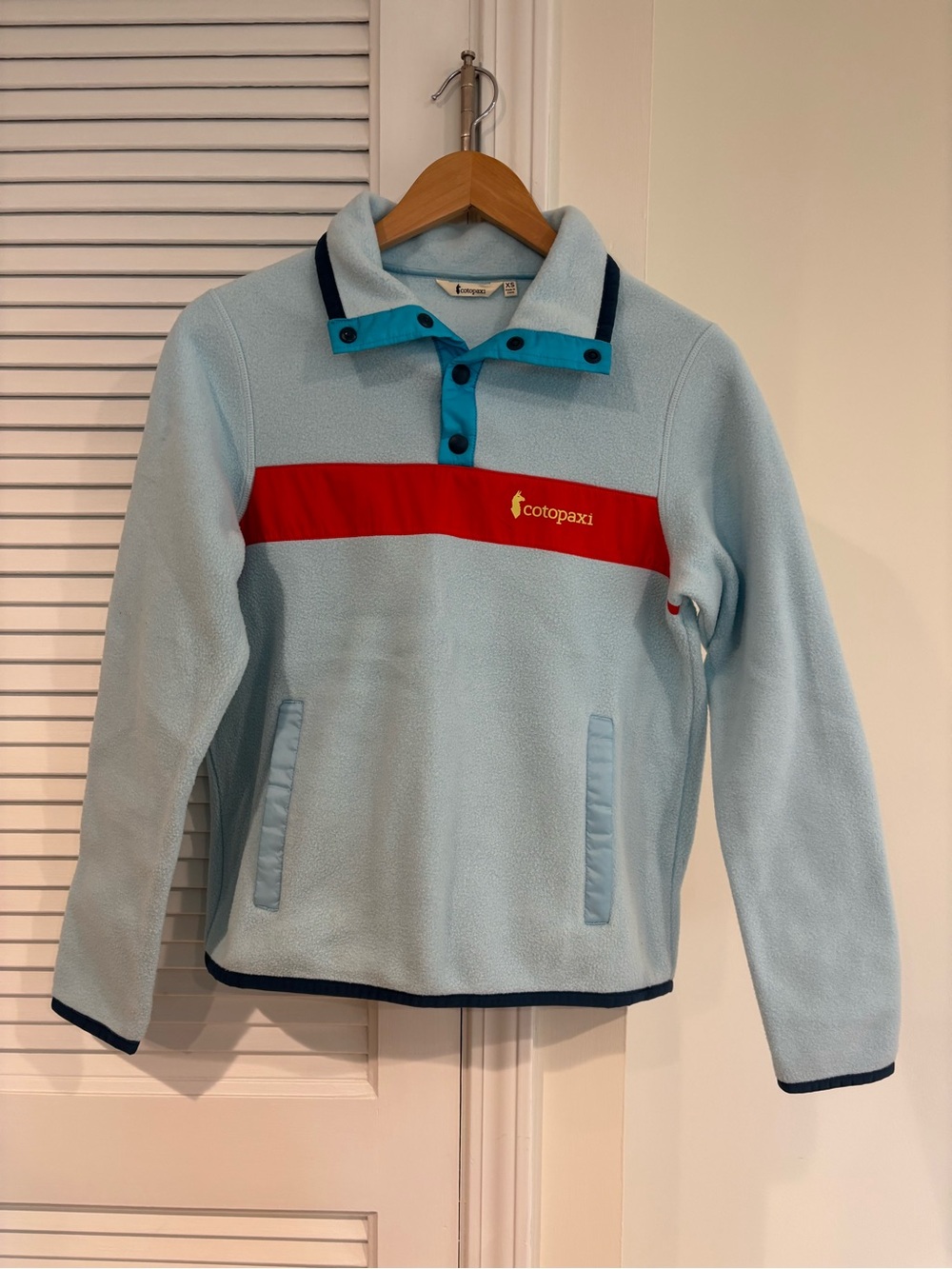 cotopaxi Light Blue Fleece Pullover with Red Chest Stripe